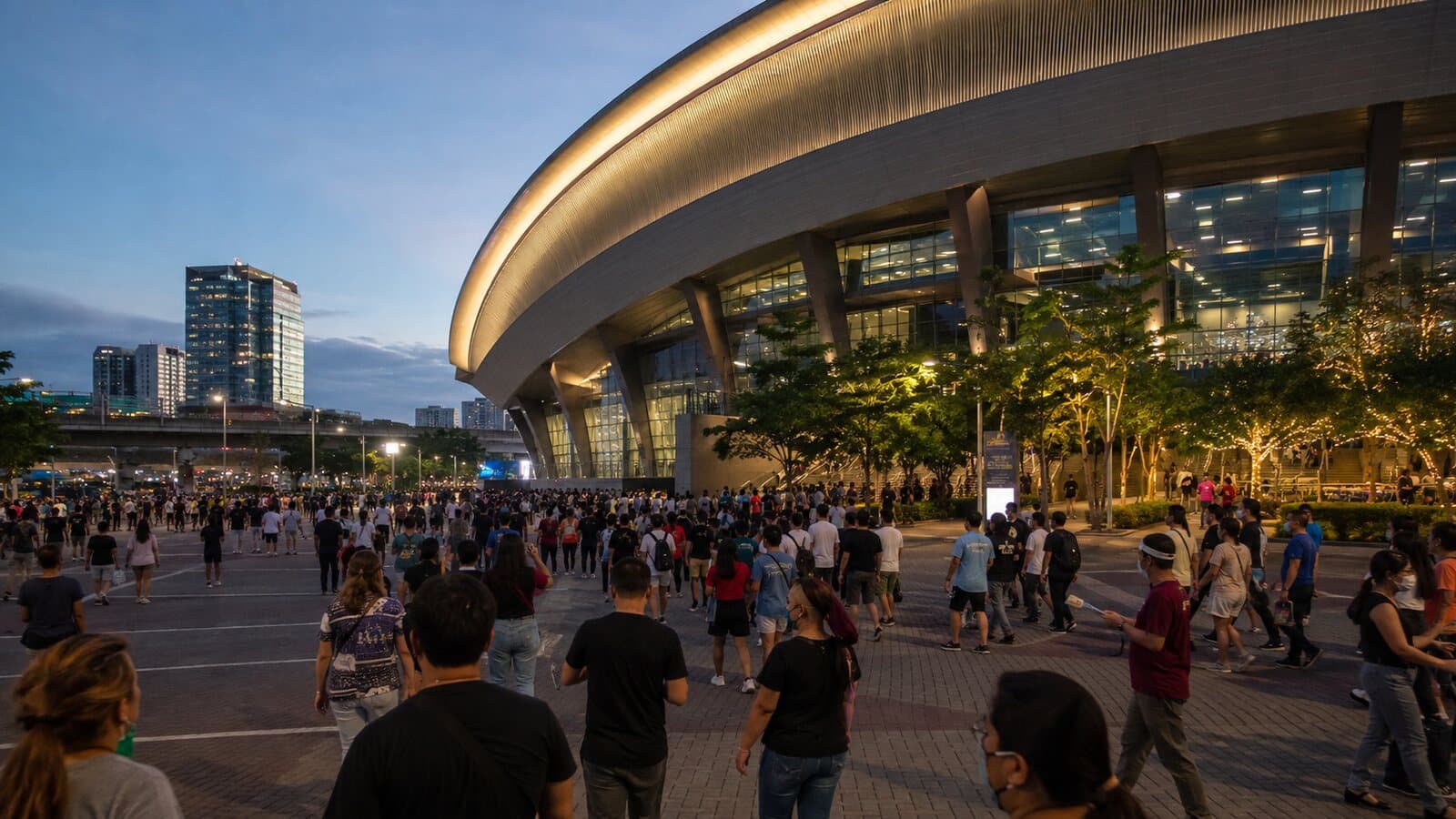 Crowds arriving at a modern arena in Pasay on an event evening