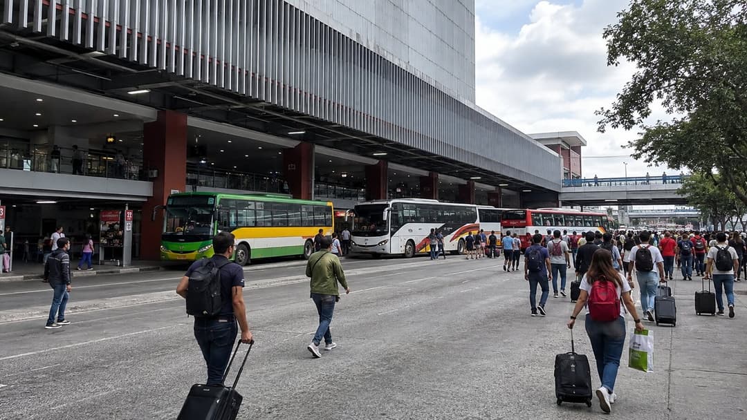 Passengers and provincial buses outside a large integrated terminal in Metro Manila