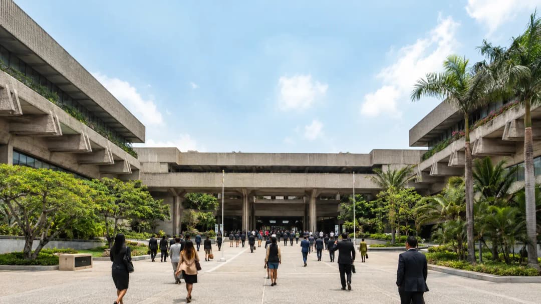 Delegates arriving at a restored modernist convention center courtyard in Pasay