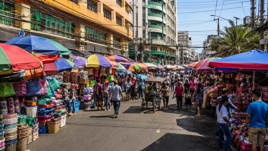 Colorful Divisoria street market in Manila with umbrellas, textiles and busy daytime shopping lanes